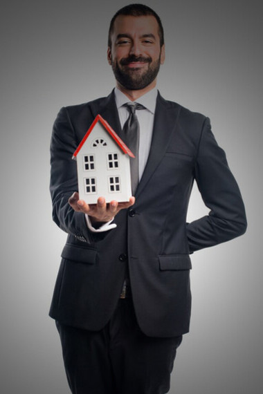 A real estate agent holding a miniature house, symbolizing luxury real estate, modern living, and the urgency of limited availability