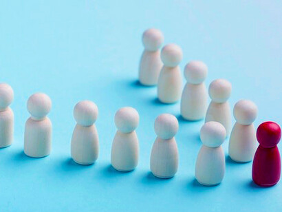 Business roles represented by diverse pawns, with leadership guiding strategic moves for success