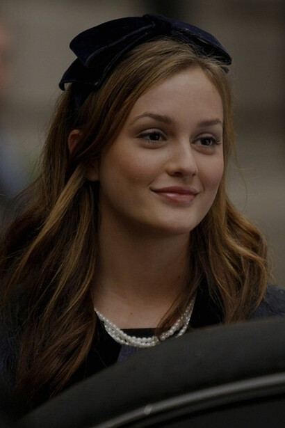 Leighton Meester, portraying Blair Waldorf, epitomizing the iconic headbands in a captivating episode of the TV show "Gossip Girl"