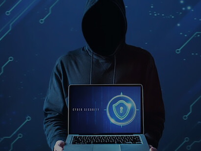 A cybersecurity expert is holding a computer