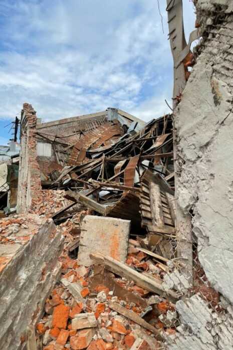 A mound of debris sits next to the wreckage of the cinema and youth center in Chernihiv, Ukraine, destroyed by an aerial bomb in March 2022