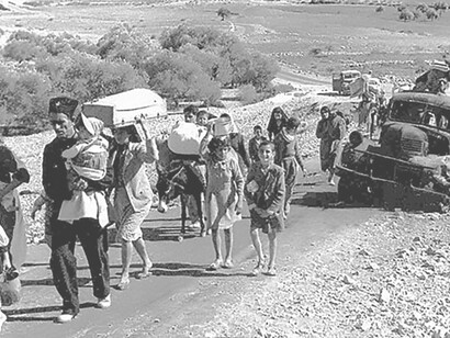 Palestinian refugees from the British Mandate of Palestine in 1948 make their way from Galilee during October-November, illustrating the displacement during that period