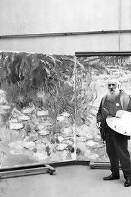 Claude Monet in his studio, in front of his Water Lilies