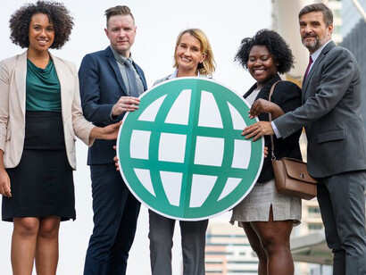 A group of successful business professionals collaborating on multi-stakeholder initiatives