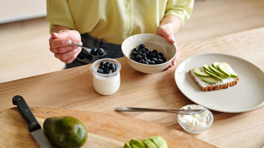 A spoonful of blueberries in yogurt provides a delicious dose of fibre and probiotics, essential for supporting a balanced gut microbiome
