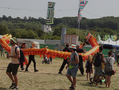 Walkabout performers entertaining the crowd at the Glastonbury Festival in England