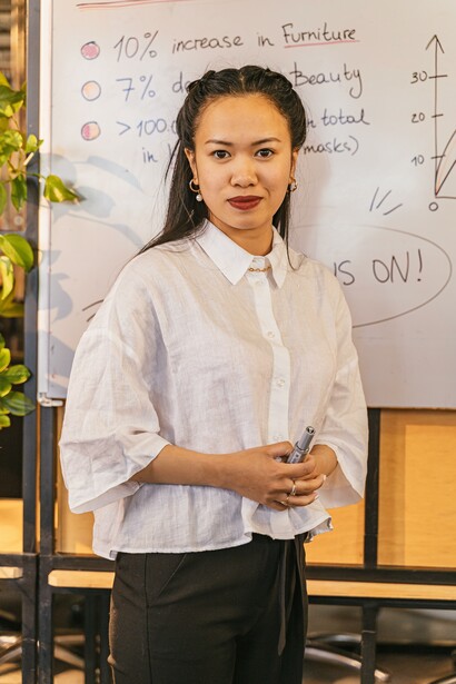 Woman getting ready to complete agenda on board