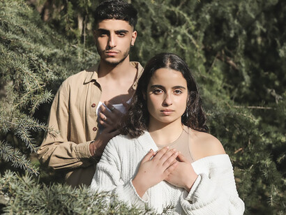 A couple seeking self-discovery amidst the tranquility of nature, endeavoring to distance themselves from external influences