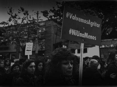 "We shout again. Not one less" reads the sign on the march for the quest for feminity 