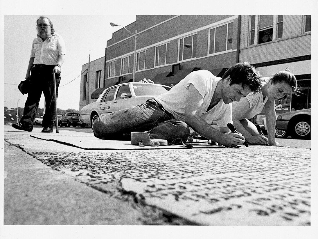 Kate Ericson and Mel Ziegler working on the public art project Loaded Text in Durham, North Carolina, 1989