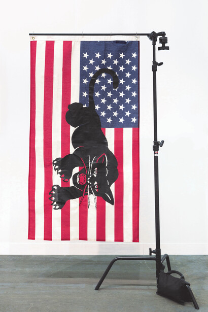 Awol Erizku, HOW THAT MAKE YOU FEEL?, 2017, Silkscreened American flag and metal flag stand 184.2 x 119.4 x 74.9 cm; (72 1/2 x 47 x 29 1/2 in.), Unique series of 5. Courtesy of Ben Brown Fine Arts