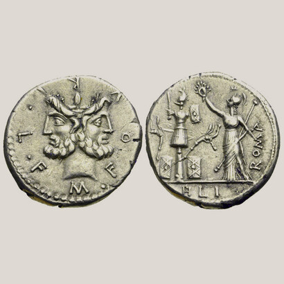 Denario con la cabeza laureada y barbuda de Jano y Roma de pie a la izquierda, sosteniendo cetro y corona