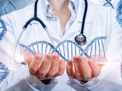An illustration of a doctor holding DNA molecules in his hands