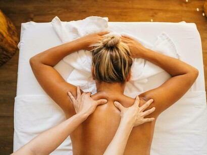 A woman receiving a deep tissue massage as she tries to heal