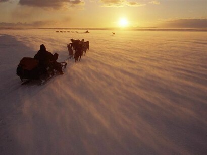 Chukchi hunters travelling by dog sled near Dezhnovka. Chukotskiy Peninsula, north east Siberia. (2006)