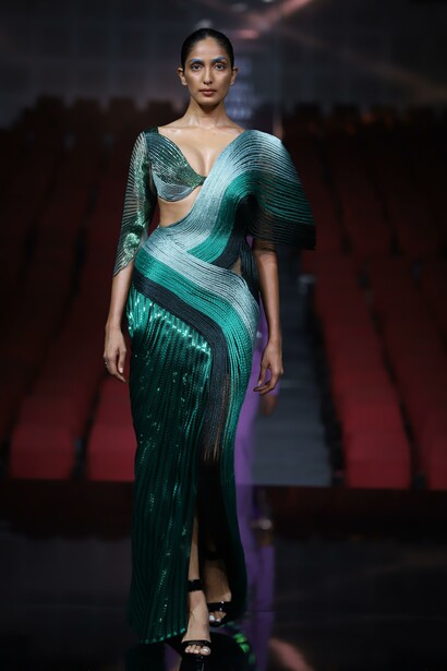 Model in green dress for Couture week 2022, New Delhi, India