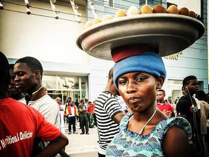 A girl sells eggs to football fans watching the Ghana vs Egypt © Nana Kofi Acquah 