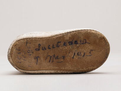 Baby's shoe, sole inscription - copyright National Museums Liverpool