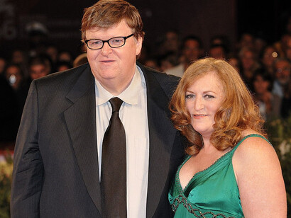Michael Moore and his wife, Kathleen Glynn, attend the red carpet premiere of Capitalism: A Love Story, his film in competition