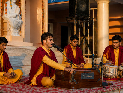 Young Vedic students participating in the Ganga Aarti ceremony at Parmarth Niketan Ashram