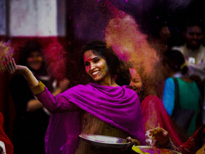 An Indian woman celebrating Holi. Today, dal is one of the easily available products and India is one of the largest producers of pulses and lentils, globally. Also, one of the foremost consumers