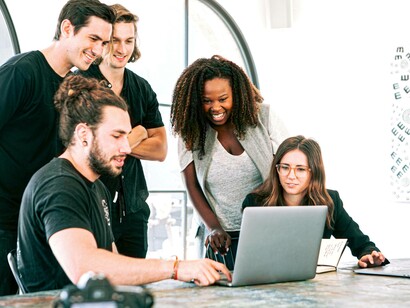 Millennials at the office and collaborating on a project hoping to earn recognition