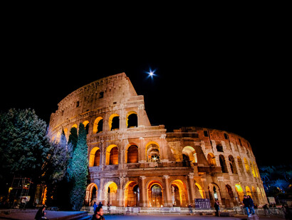 Front of the Roman Colosseum at night, Rome, Italy