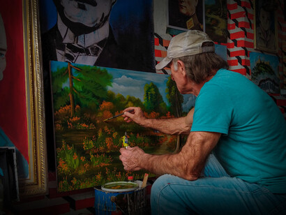 Creativity comes in many forms, as a man paints with bold colors and bold ideas