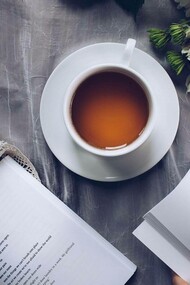 Poems being enjoyed over a couple of tea with the scatterings of nature in its surroundings