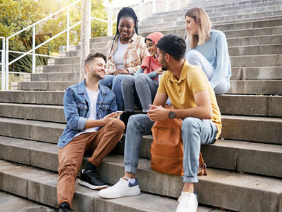 Students are chatting on the stairs, sharing their plans and ambitions for the future