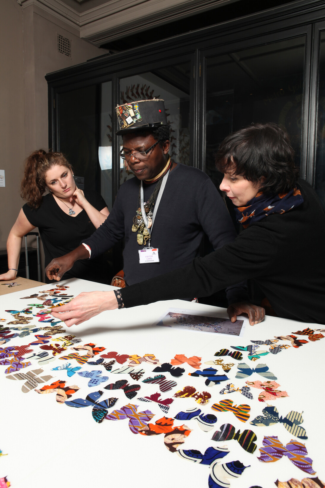 Romuald Hazoumè installs Dance of the Butterflies. Photo Alan Seabright