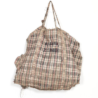 Dan Halter, Bamba zonke, 2016, Found plastic-weave bag, custom-made tartan fabric, 65 x 70 cm. Courtesy Dan Halter and Osart Gallery