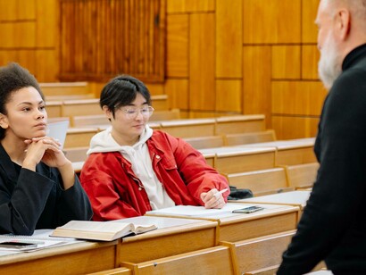 College teacher discussing lecture with students