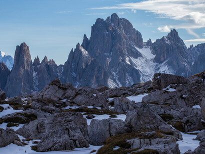 Imposing mountains and large rocks at their feet