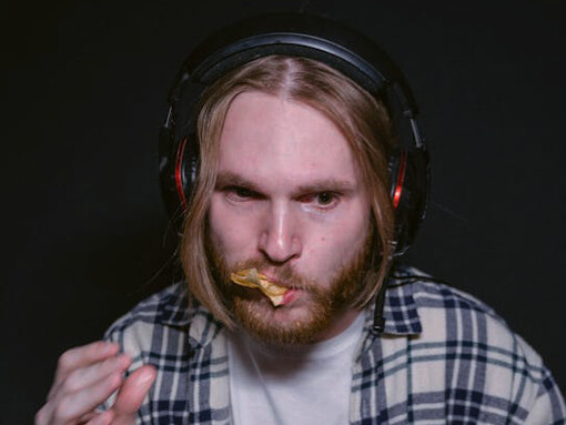 With eyes glued to the screen, a young individual delves deeper into the digital realm, seeking validation and fulfilment amidst a sea of online achievements, experiencing the true wrath of addiction