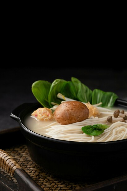 A bowl of ramen placed on a black background