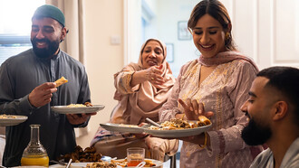 A Pakistani family gathers around the table to enjoy dinner together