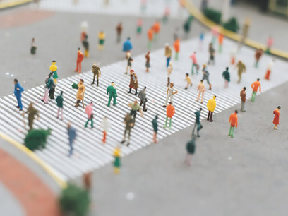 Image of people walking on a striped road