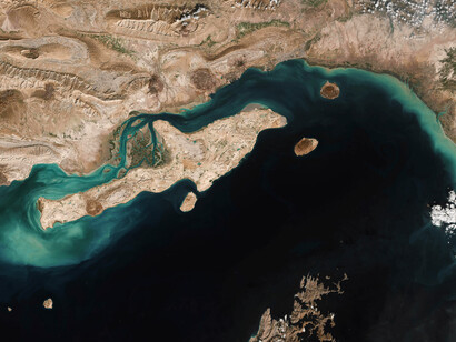 On December 2, 2020, NASA’s Terra satellite used the Moderate Resolution Imaging Spectroradiometer (MODIS) to capture a true-color view of the Strait of Hormuz, a crucial passageway for global oil tanker traffic and energy shipments