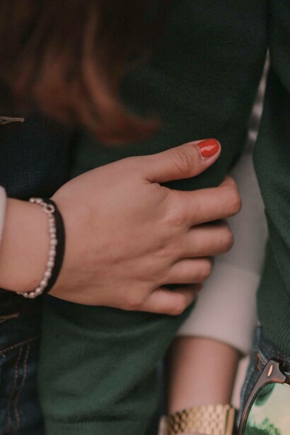 Two people warmly embrace each other