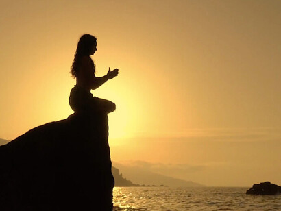 Sitting amidst the calming waves, she shows us that in silence, we can uncover the hidden voices and desires that often go unnoticed