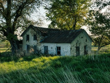 An old family home preserved by memory rather than renovation, reflecting the weight of inherited traditions