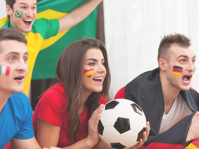Soccer fandom portraying young fans captivated by the match on TV, showcasing the electrifying atmosphere of sports enthusiasm and engagement