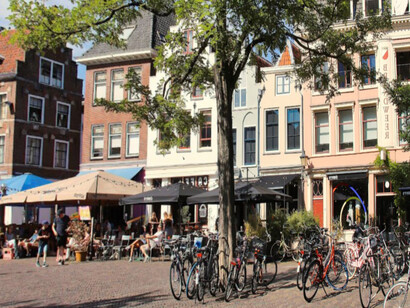Bikes are neatly parked side by side on a street in Utrecht, reflecting the city’s strong cycling culture