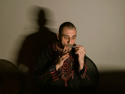 The harmonica serves as his voice, demonstrating the profound impact of music therapy on emotional expression and resilience