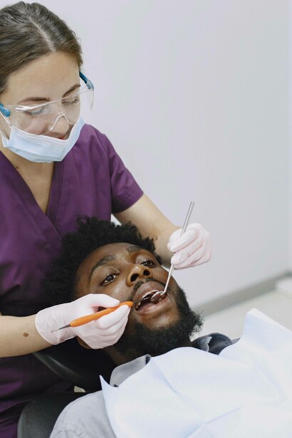 Dentist diligently observing patient teeth