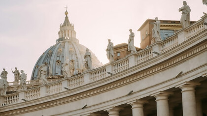 The sculptures adorning the top of St. Peter's Basilica in Italy, notably the colossal statues of saints and angels, stand as majestic symbols of religious devotion and architectural mastery, Vatican