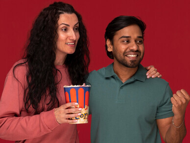 An Indian couple stands together, symbolizing the essence of cinematic storytelling and the values of community and transformation