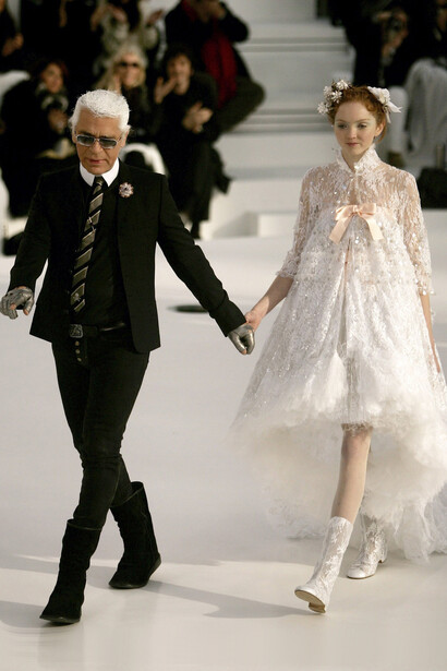 Fashion designer Karl Lagerfeld walks the runway with top model Lily Cole. S/S 2006