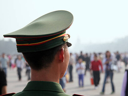 A Chinese soldier from behind, representing China's military strength and advanced military technology